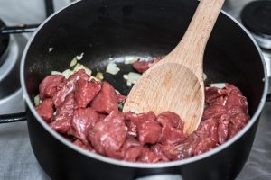 Cooking beef stew.